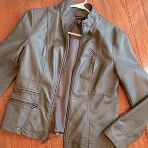 Beautiful gray soft faux leather jacket. Front zip closure with silver hardware